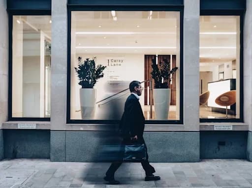 Consultant walking down a sidewalk